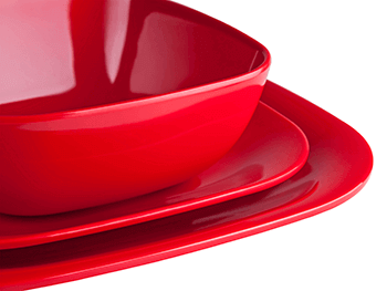 three red plates made through compression moulding